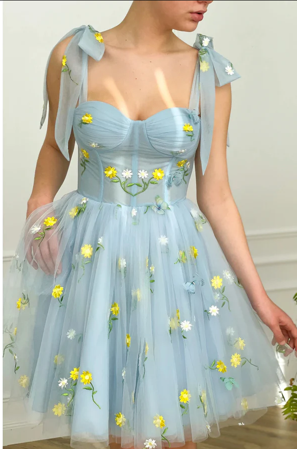 Light blue dress store with yellow flowers